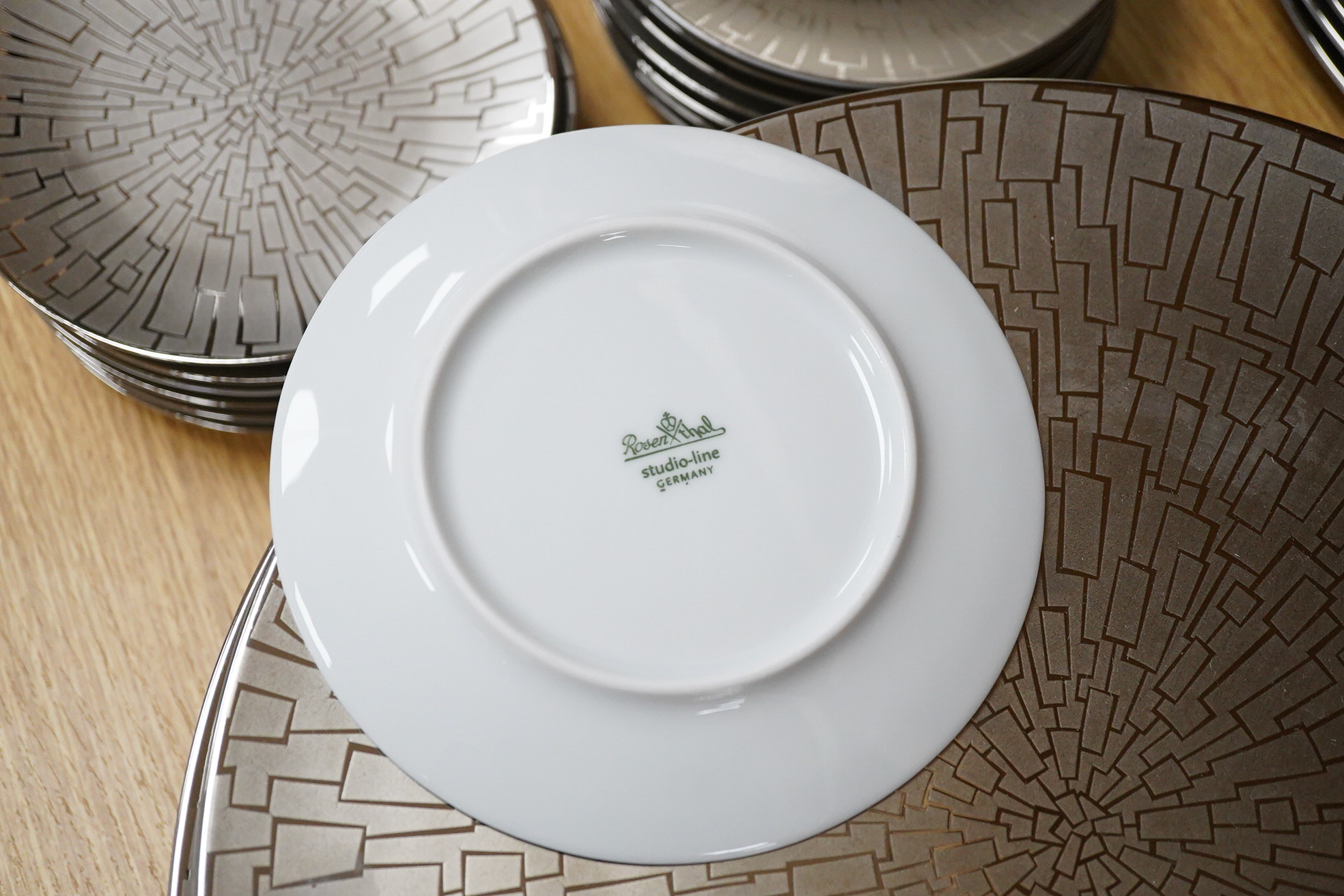 A collection of Rosenthal studio line TAC Gropius Skin platinum dinnerware, largest 33cm in diameter